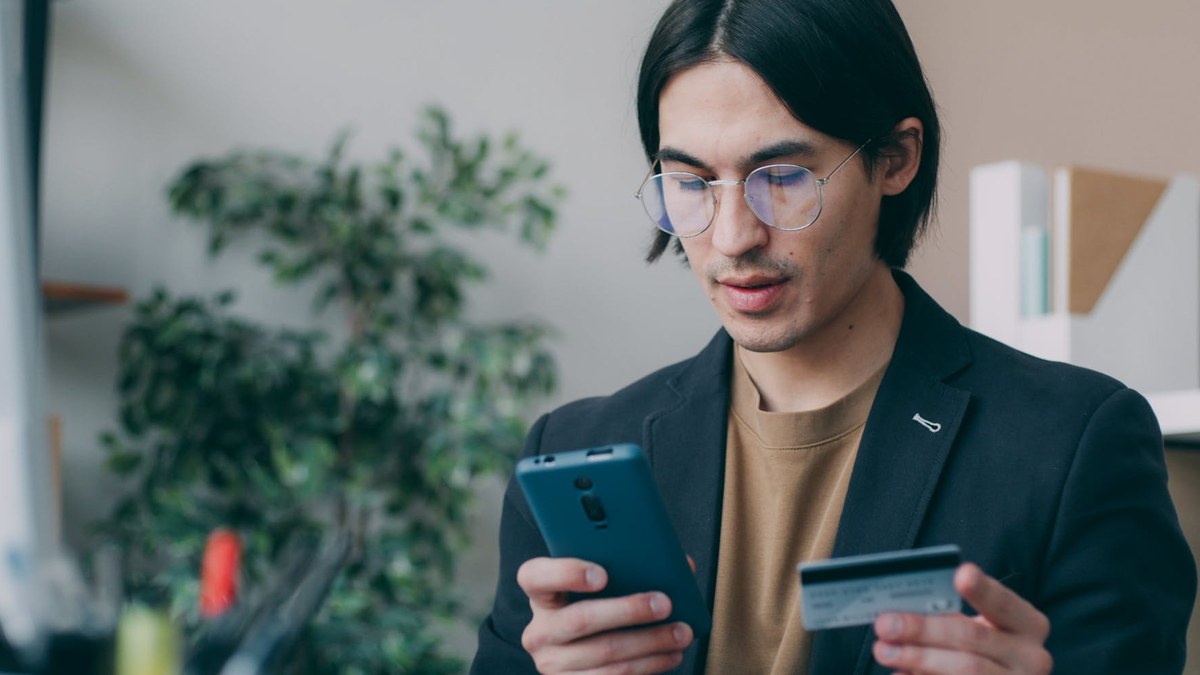 korean young adult checking credit score on smartphone, financial planning app