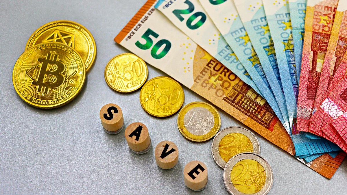 stack of korean won banknotes neatly arranged on a wooden desk next to a piggy bank