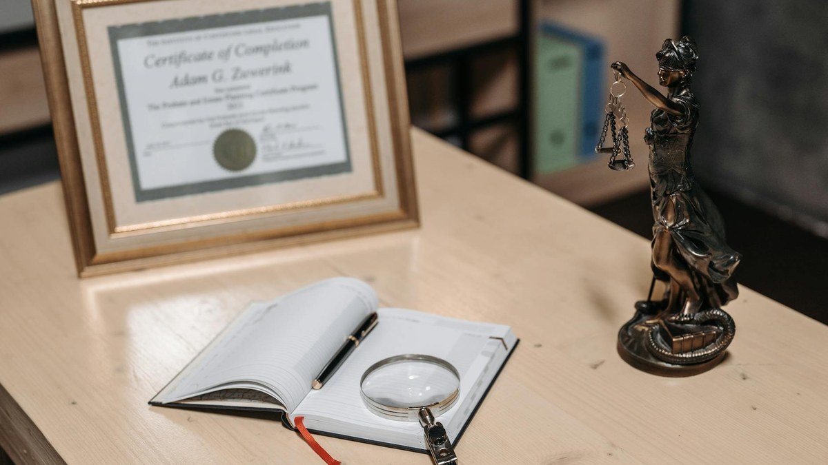 scales of justice next to a storefront sign