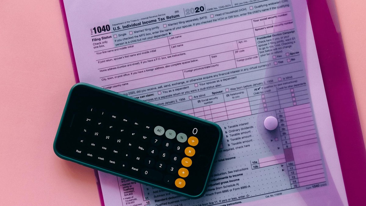 calculator and documents showing social insurance premiums and government subsidy papers