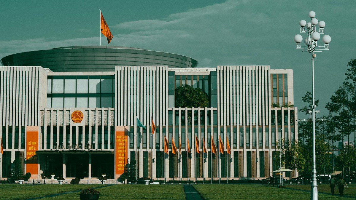 government building facade with Korean flag, symbolizing support programs