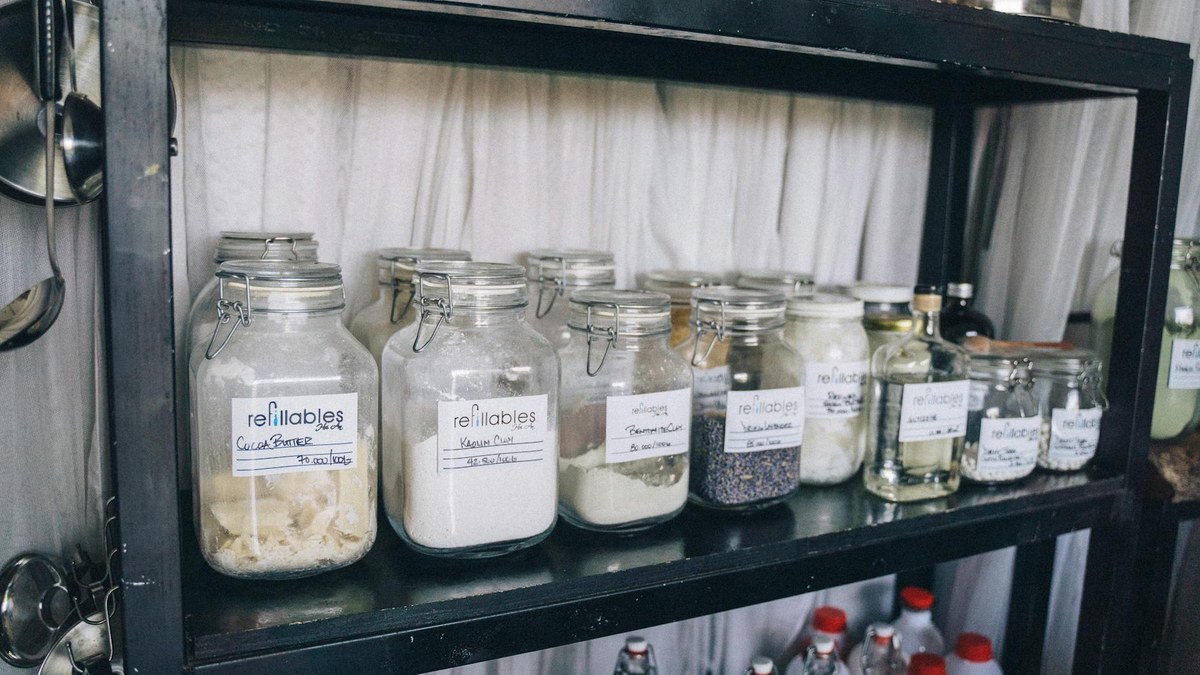 kitchen pantry shelves neatly organized with different sized storage containers