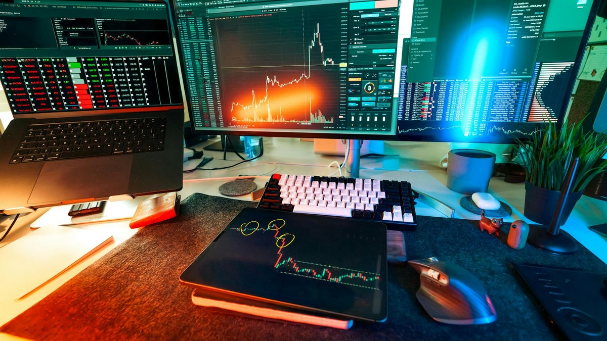 modern office with multiple screens displaying network security dashboards