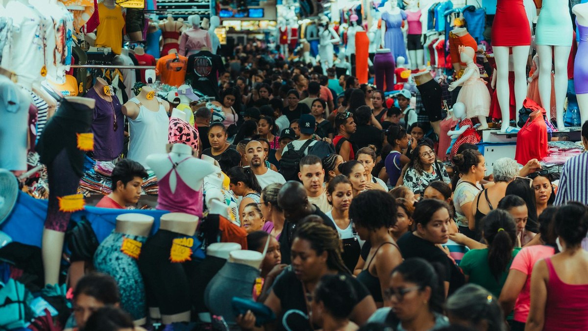 group of diverse avatars shopping together in a vibrant virtual marketplace