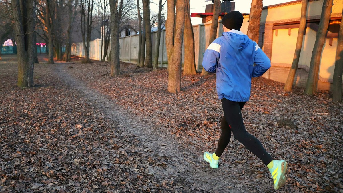 person alternating between brisk and moderate walking pace on a path