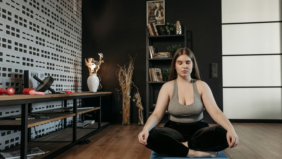 person practicing deep breathing exercises in a quiet room