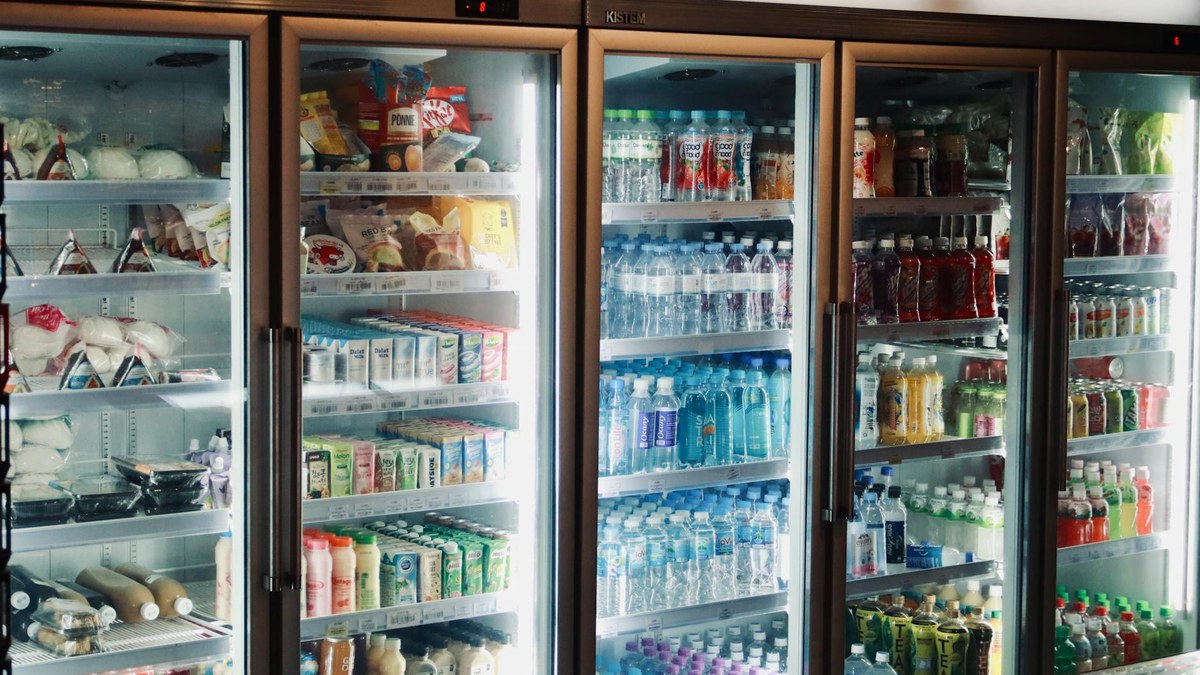 person storing vacuum-sealed smoked duck in refrigerator