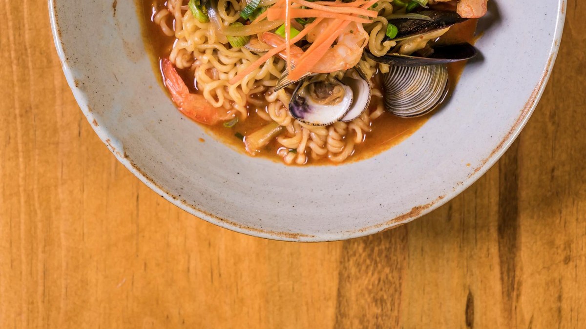 Korean style seafood noodle soup with clams, warm and inviting