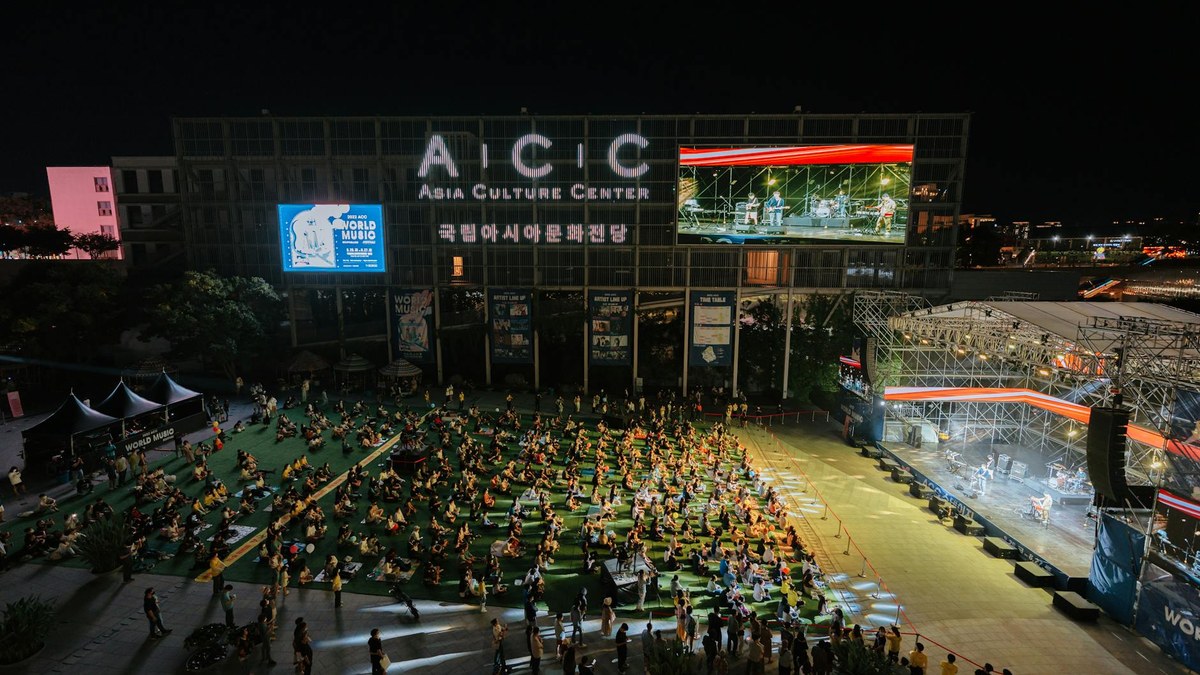 korean senior couple enjoying a cultural outing, attending a concert, happy and engaged
