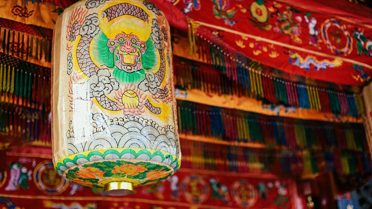 Close-up of intricate Korean lotus lanterns in a temple courtyard
