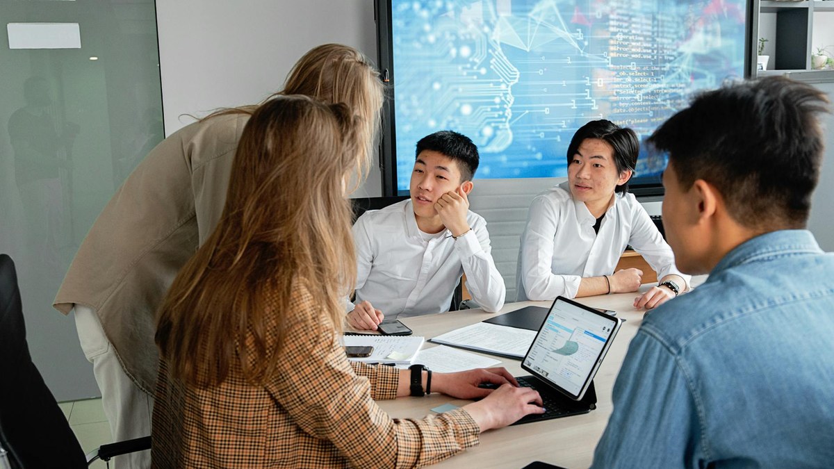 diverse group of professionals collaborating with AI agents on digital interfaces