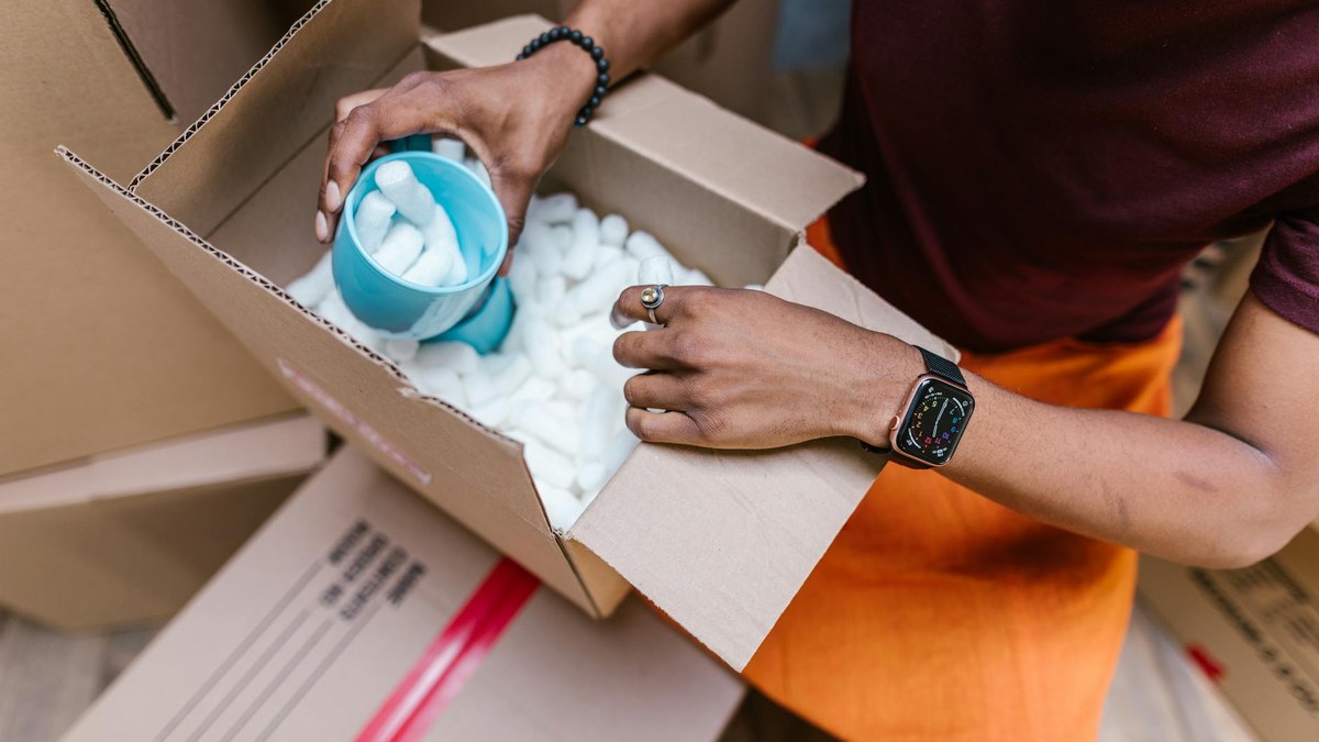 close-up of hands holding biodegradable packing peanuts made from starch, natural light