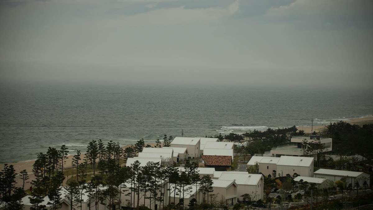 Gangwon east coast seaside village with traditional houses and blue sea