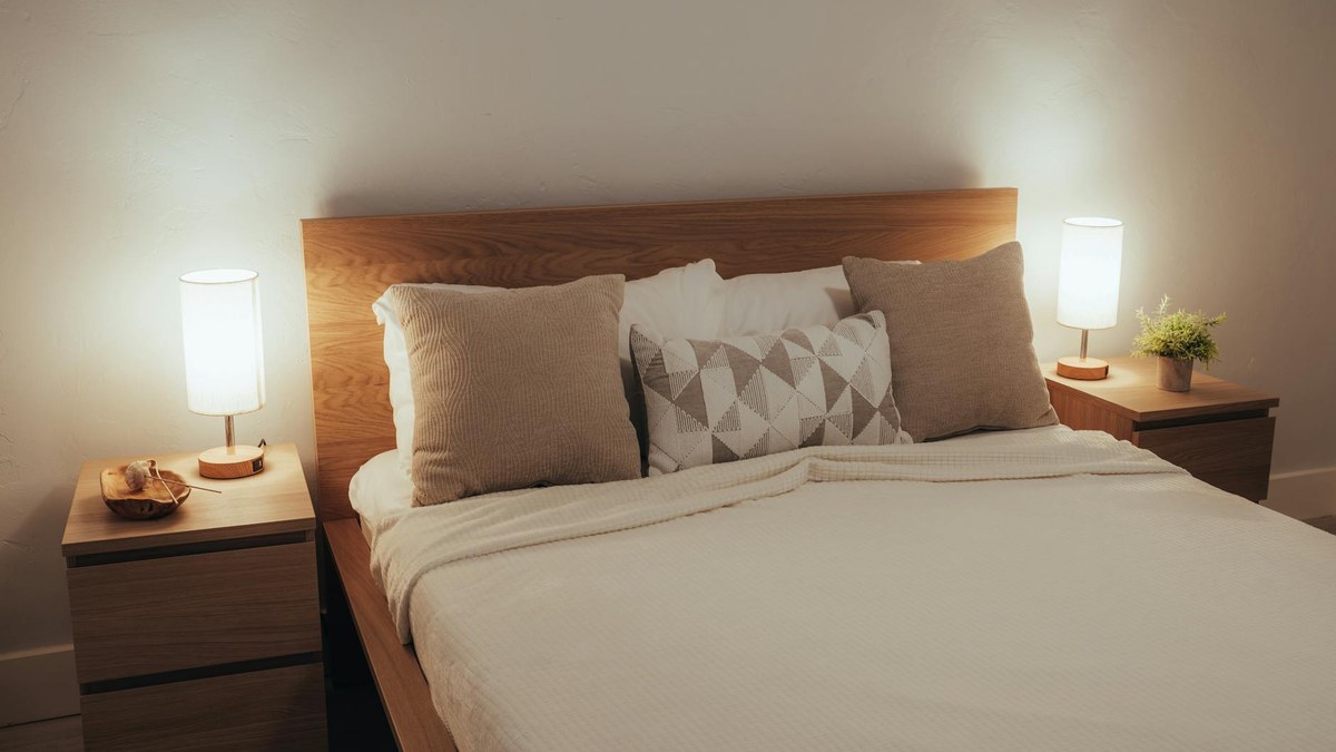 cozy bedroom with soft lighting and tidy bed